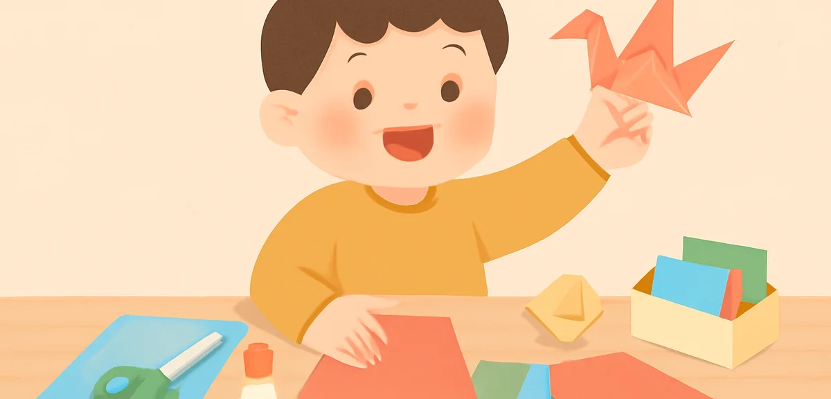 折り紙や工作キットを広げてものづくりを楽しむ小学生、机に画用紙やハサミ、のり