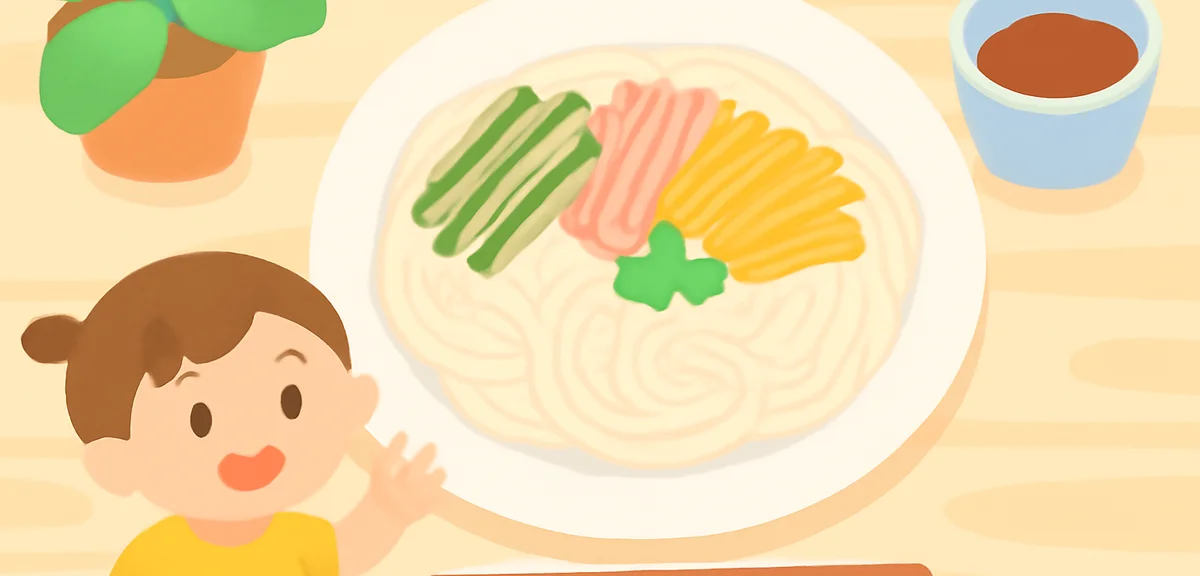 A plate of cold somen noodles with colorful toppings like cucumber, ham, and egg, summer lunch for k