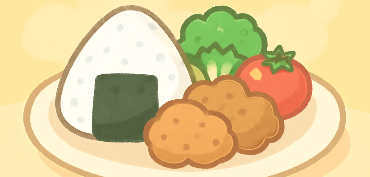 A one-plate lunch with rice ball, fried chicken, broccoli, and tomato, kid-friendly meal, natural li