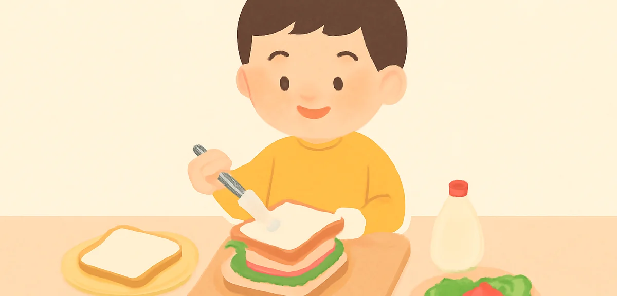 小学生くらいの子どもが、火を使わずにサンドイッチを作っている様子。安全で明るい雰囲気