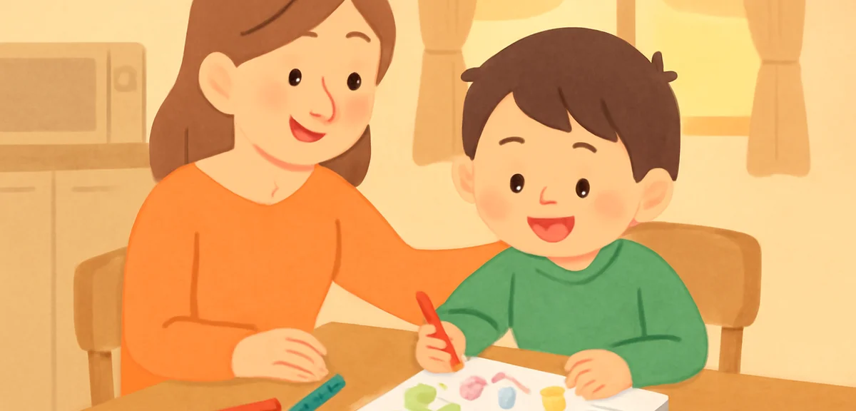 A parent smiling and gently guiding a child who is finishing a picture diary at a kitchen table, col